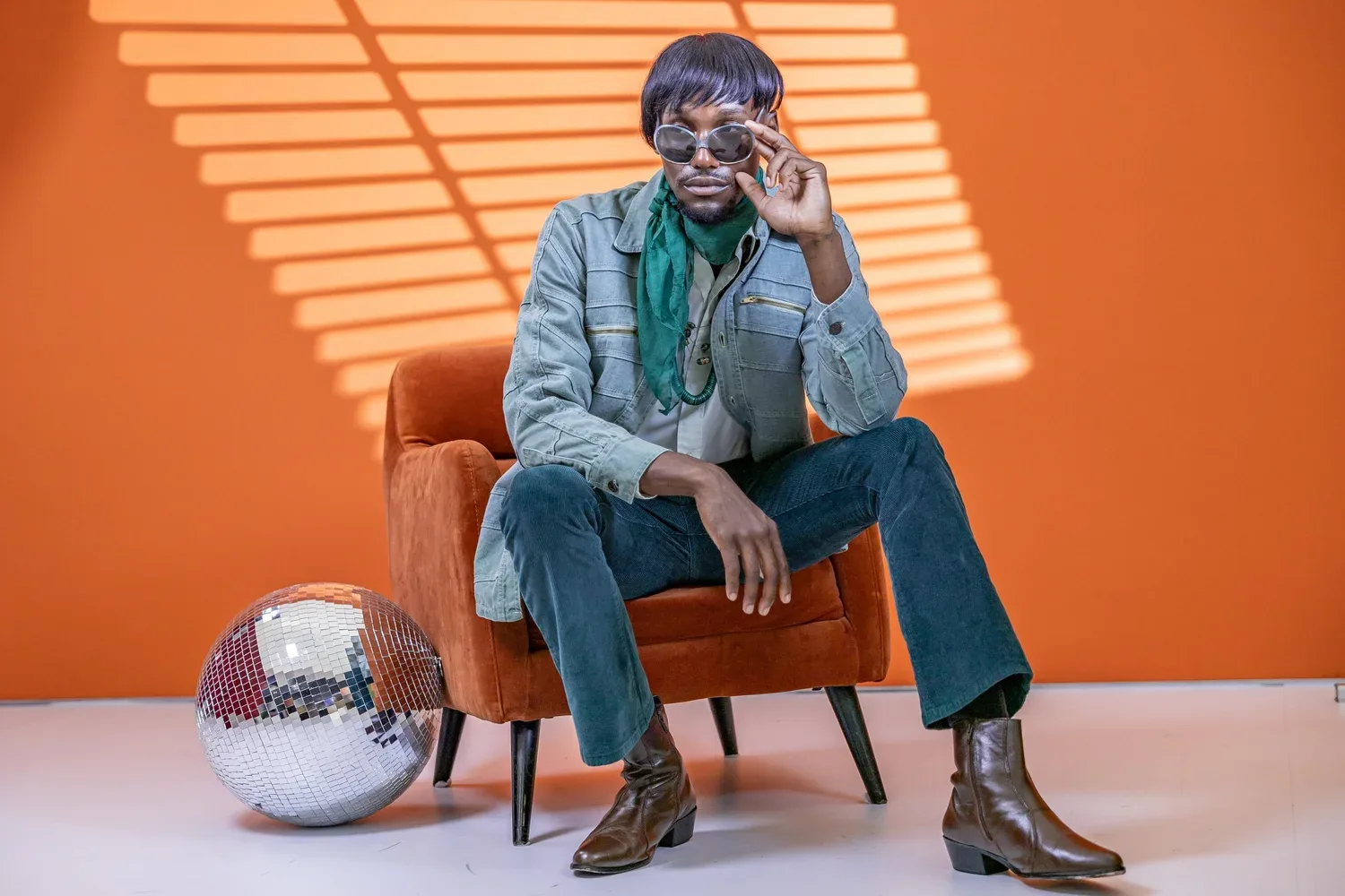 Man in 1970s styled attire on street