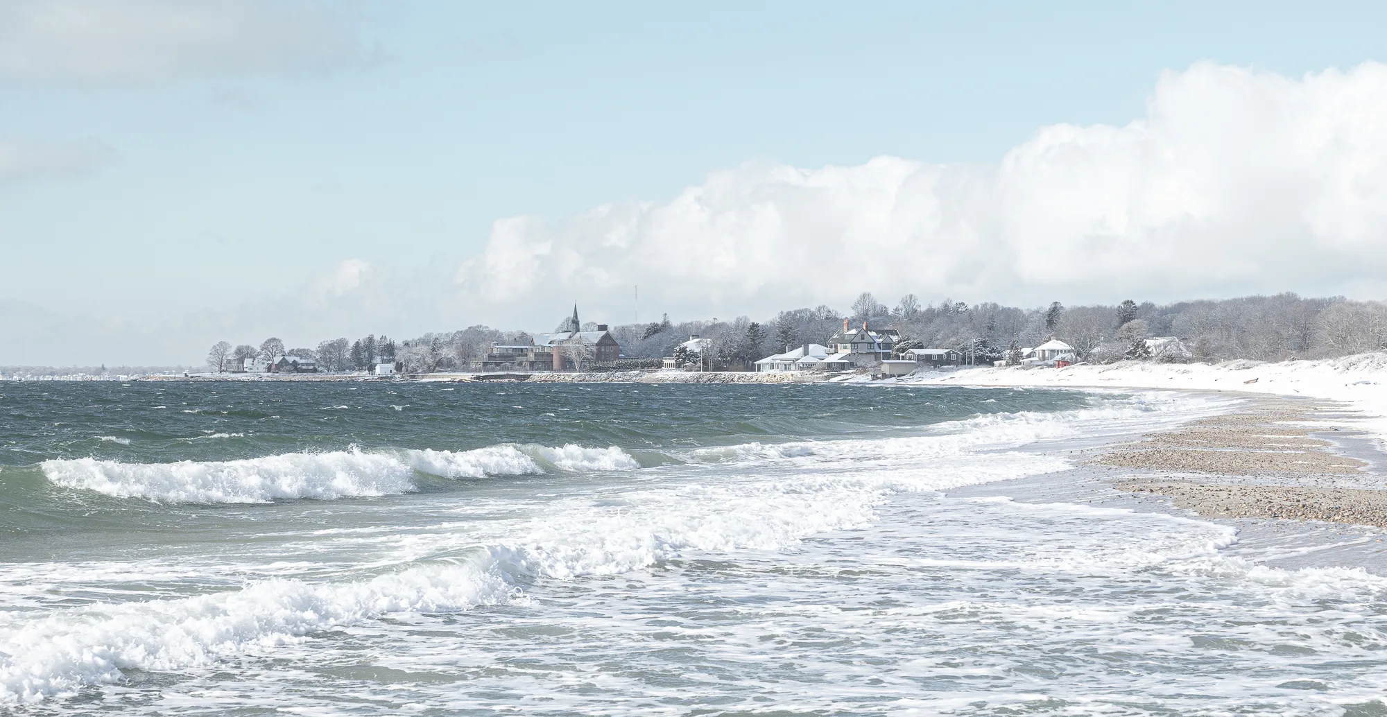 Coastal winter seascape over ocean snow view