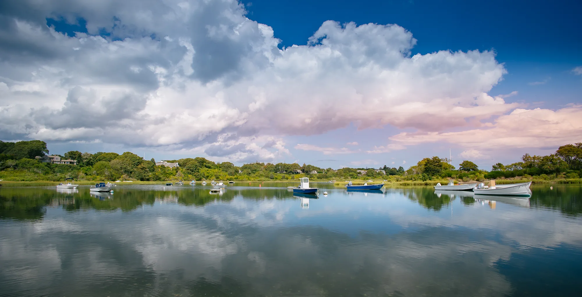 Sweeping panoramic cloudscape over coastal waters